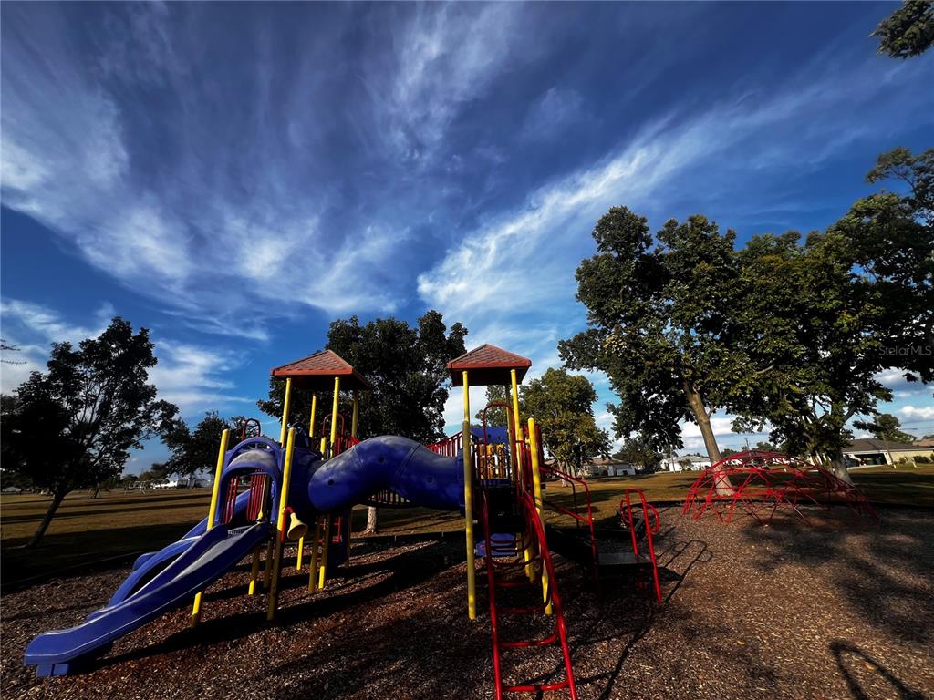 25450 Islas Drive Punta Gorda, FL 33955 - Photo 17 of 21 a view of a room with lots of swings and slides
