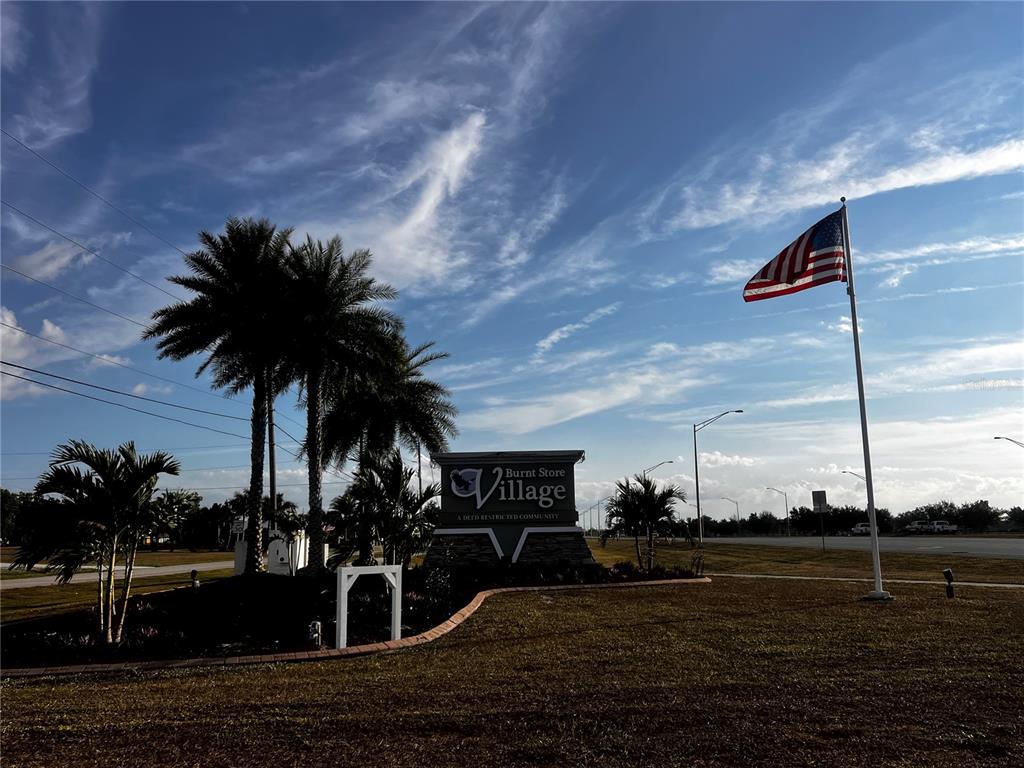 25450 Islas Drive Punta Gorda, FL 33955 - Photo 19 of 21 a view of a house with a yard