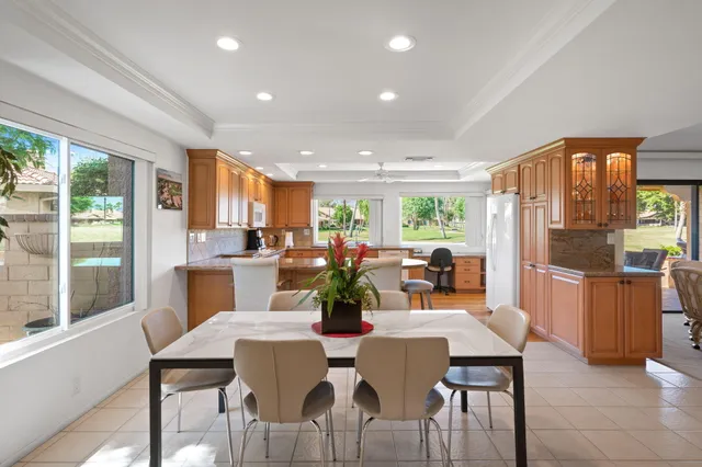 a view of a dining room with furniture window and outside view