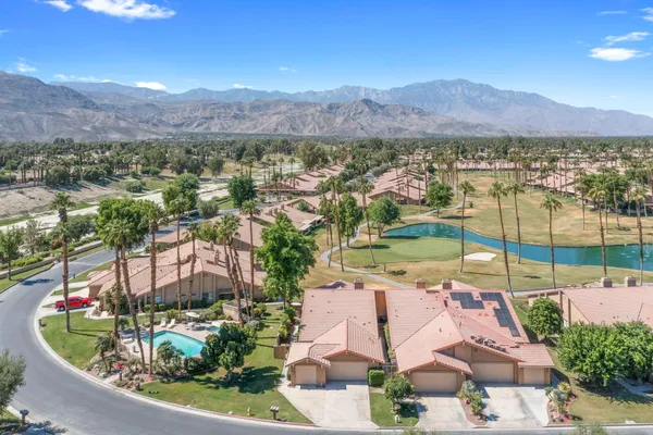 an aerial view of residential houses and outdoor space
