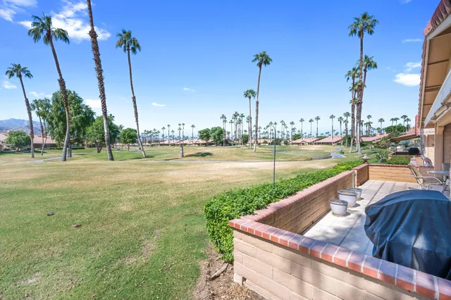a view of a garden with a lake view
