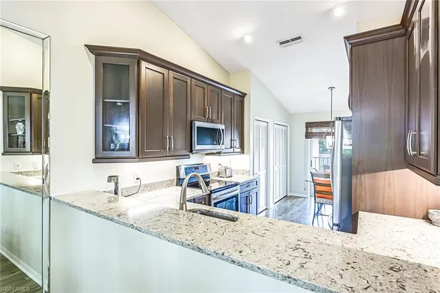 a en suite bathroom with sink and mirror