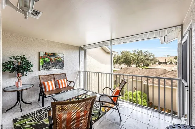 a view of a porch with furniture and a window