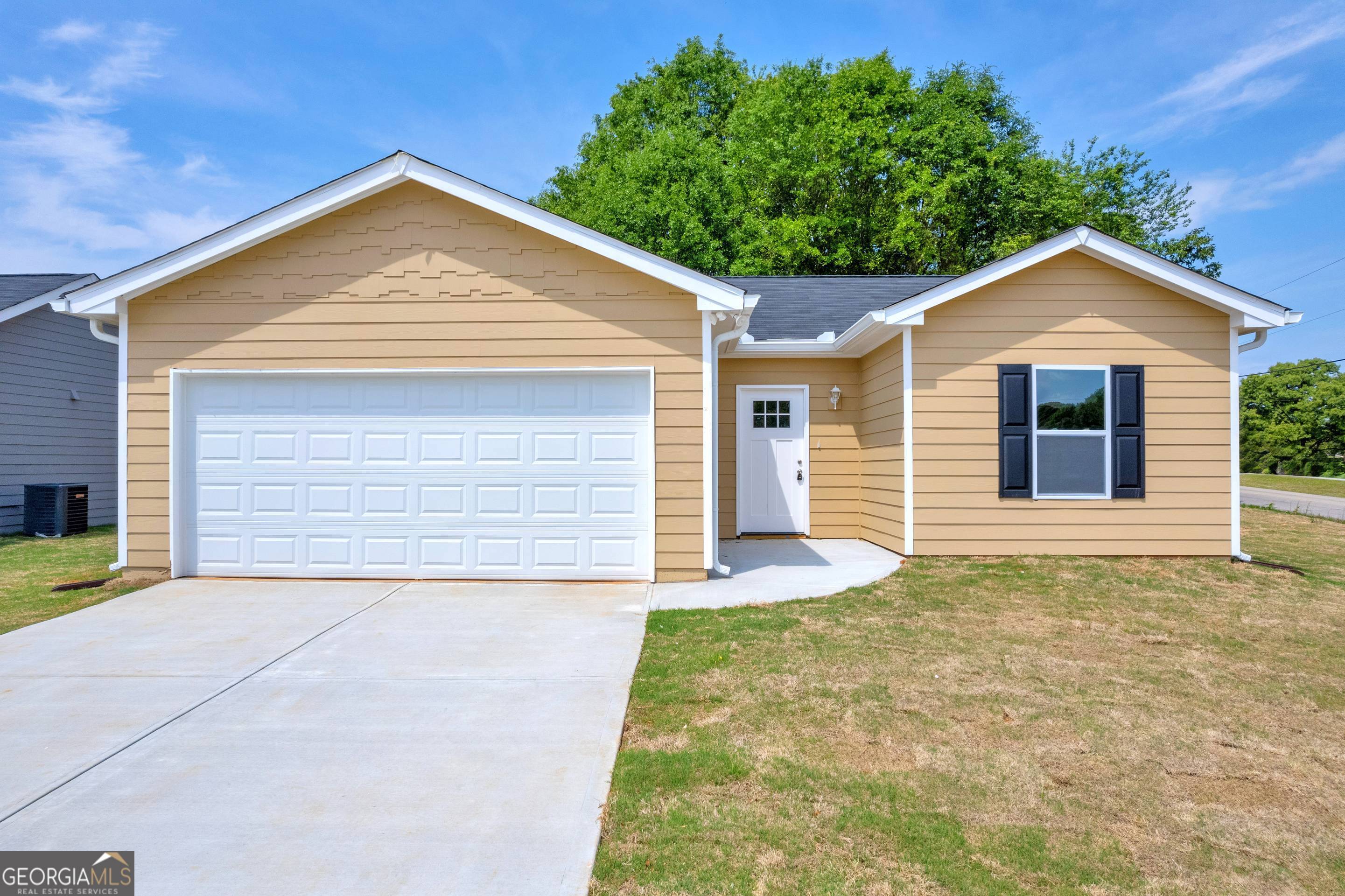150 Adaline Court Carnesville, GA 30521 - Photo 6 of 23 a view of yellow house with small yard and large tree
