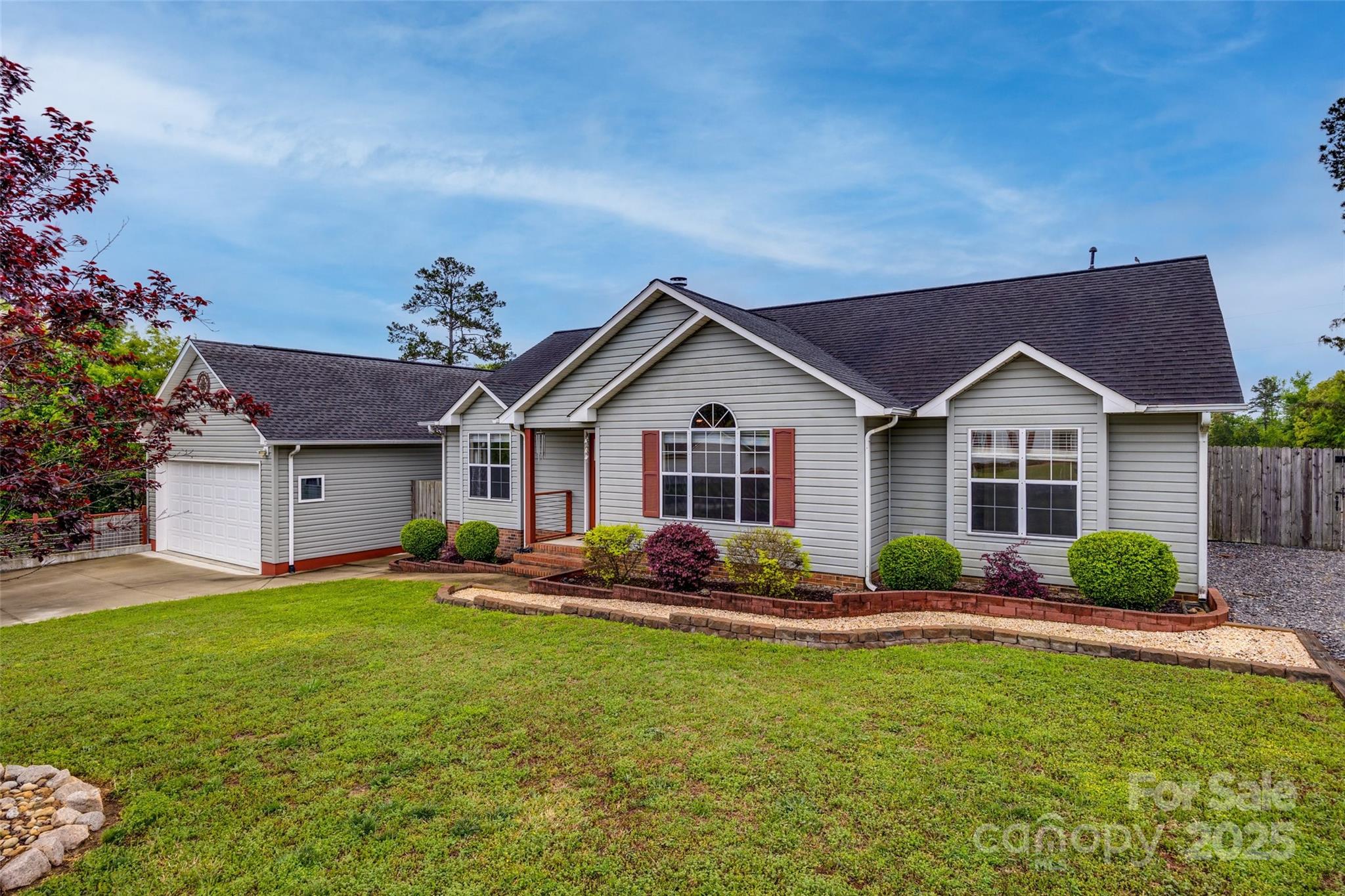 a front view of house with yard and outdoor seating