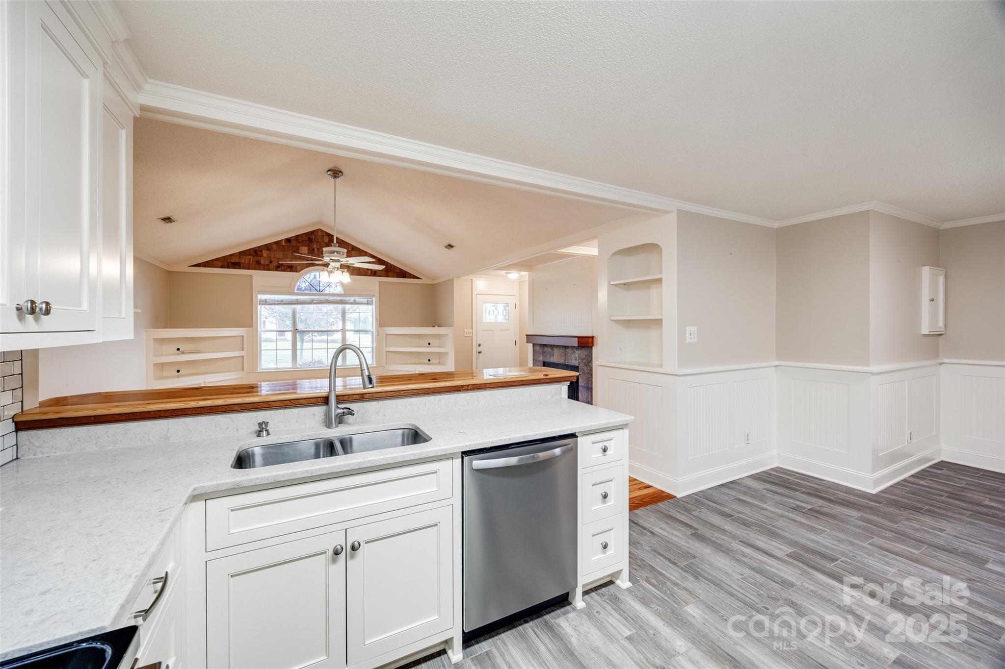 1545 Wimbleton Woods Drive Fort Mill, SC 29708 - Photo 11 of 42 a kitchen with a sink cabinets appliances and a window