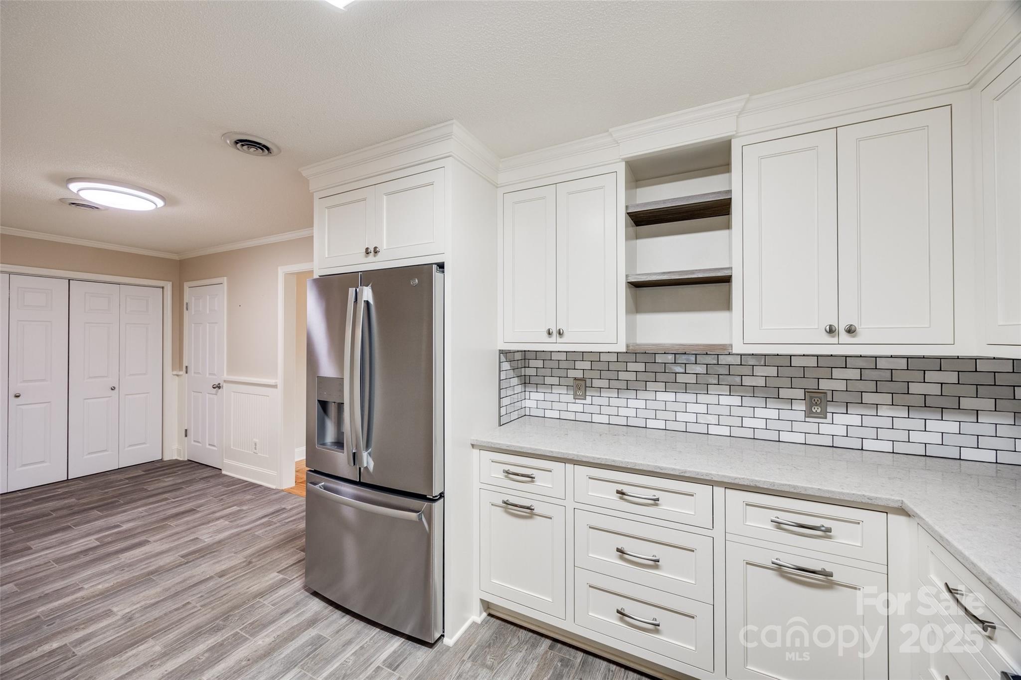 1545 Wimbleton Woods Drive Fort Mill, SC 29708 - Photo 12 of 42 a kitchen with stainless steel appliances granite countertop a refrigerator sink and cabinets