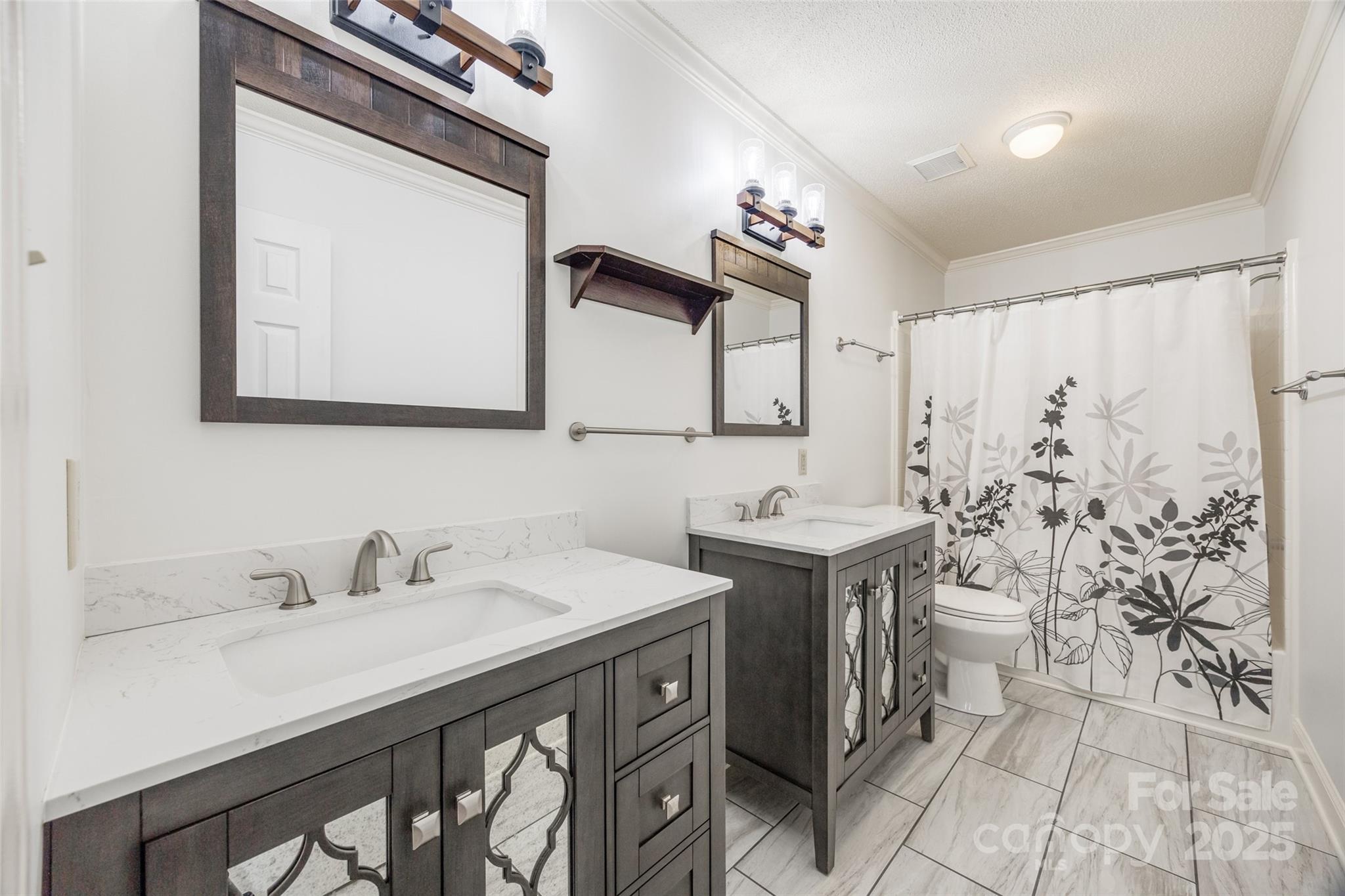 1545 Wimbleton Woods Drive Fort Mill, SC 29708 - Photo 21 of 42 a bathroom with double sink and a mirror