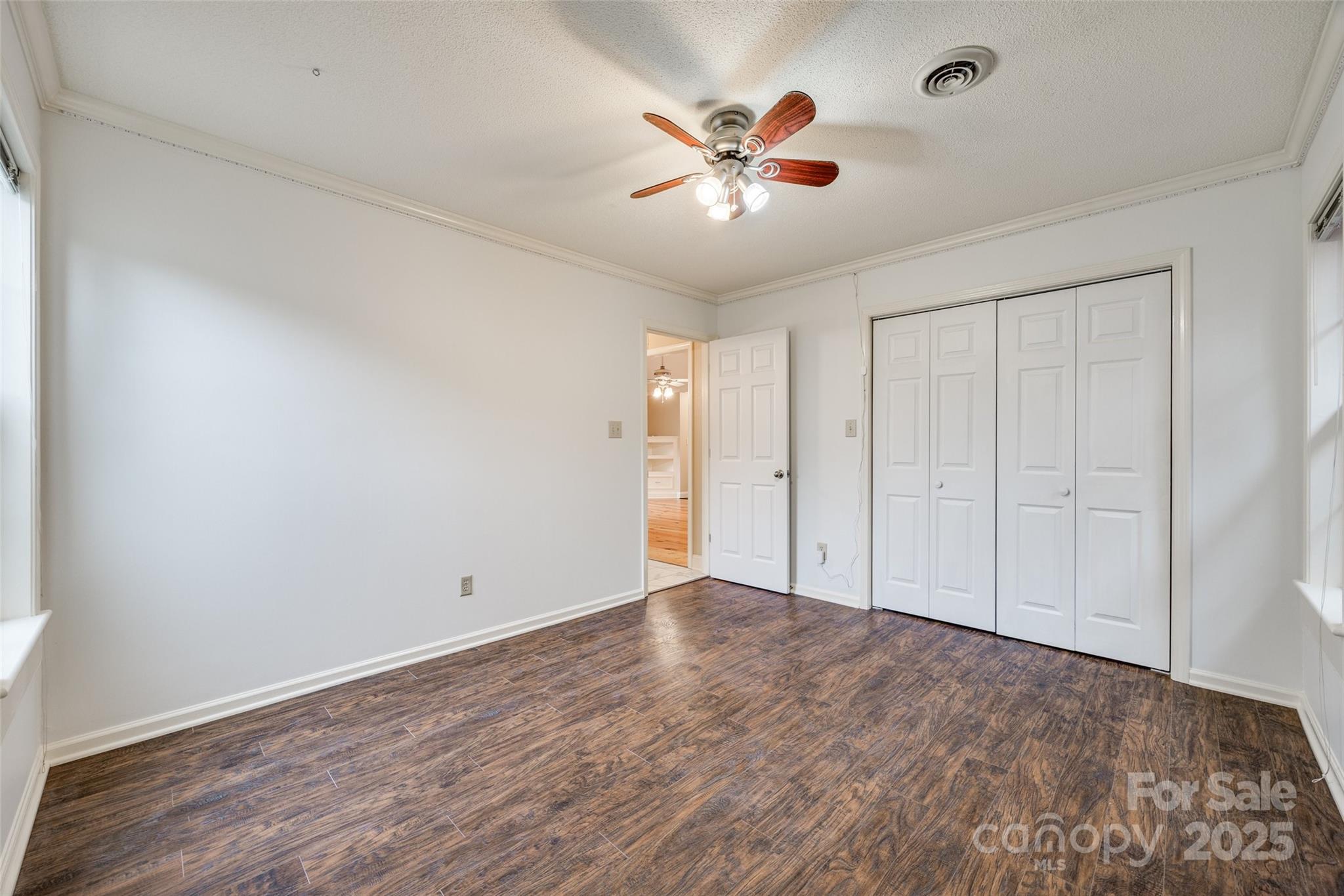 1545 Wimbleton Woods Drive Fort Mill, SC 29708 - Photo 24 of 42 a view of an empty room with window and wooden floor