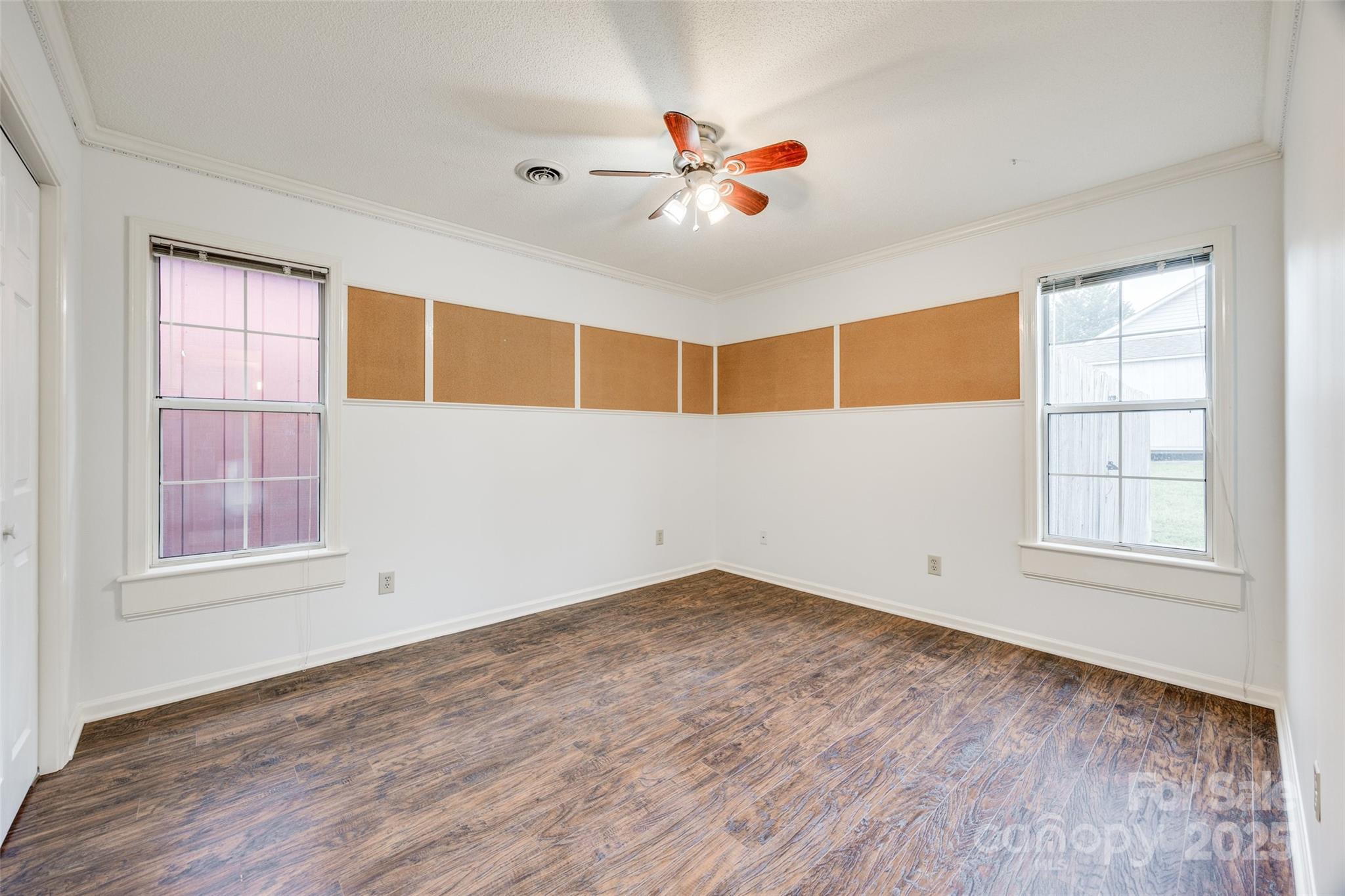1545 Wimbleton Woods Drive Fort Mill, SC 29708 - Photo 25 of 42 a view of empty room with wooden floor and fan