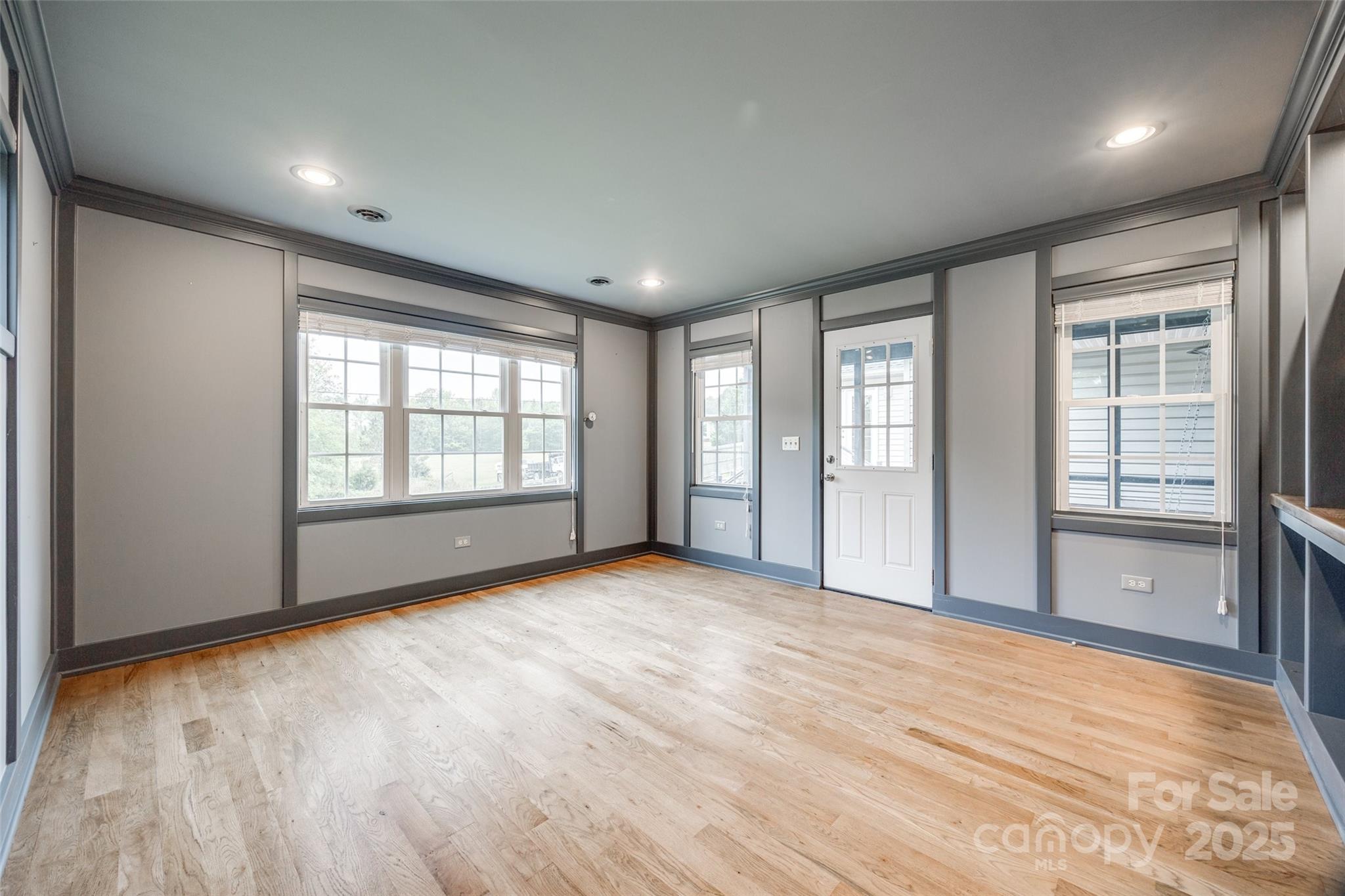 1545 Wimbleton Woods Drive Fort Mill, SC 29708 - Photo 28 of 42 a view of an empty room with a window and wooden floor