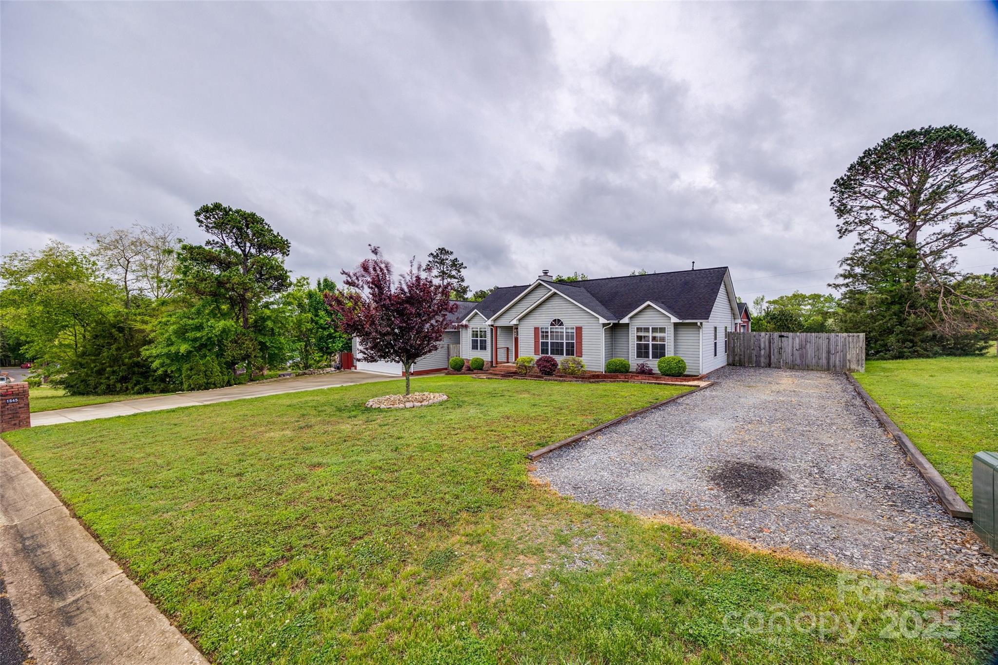 1545 Wimbleton Woods Drive Fort Mill, SC 29708 - Photo 37 of 42 a front view of a house with a yard