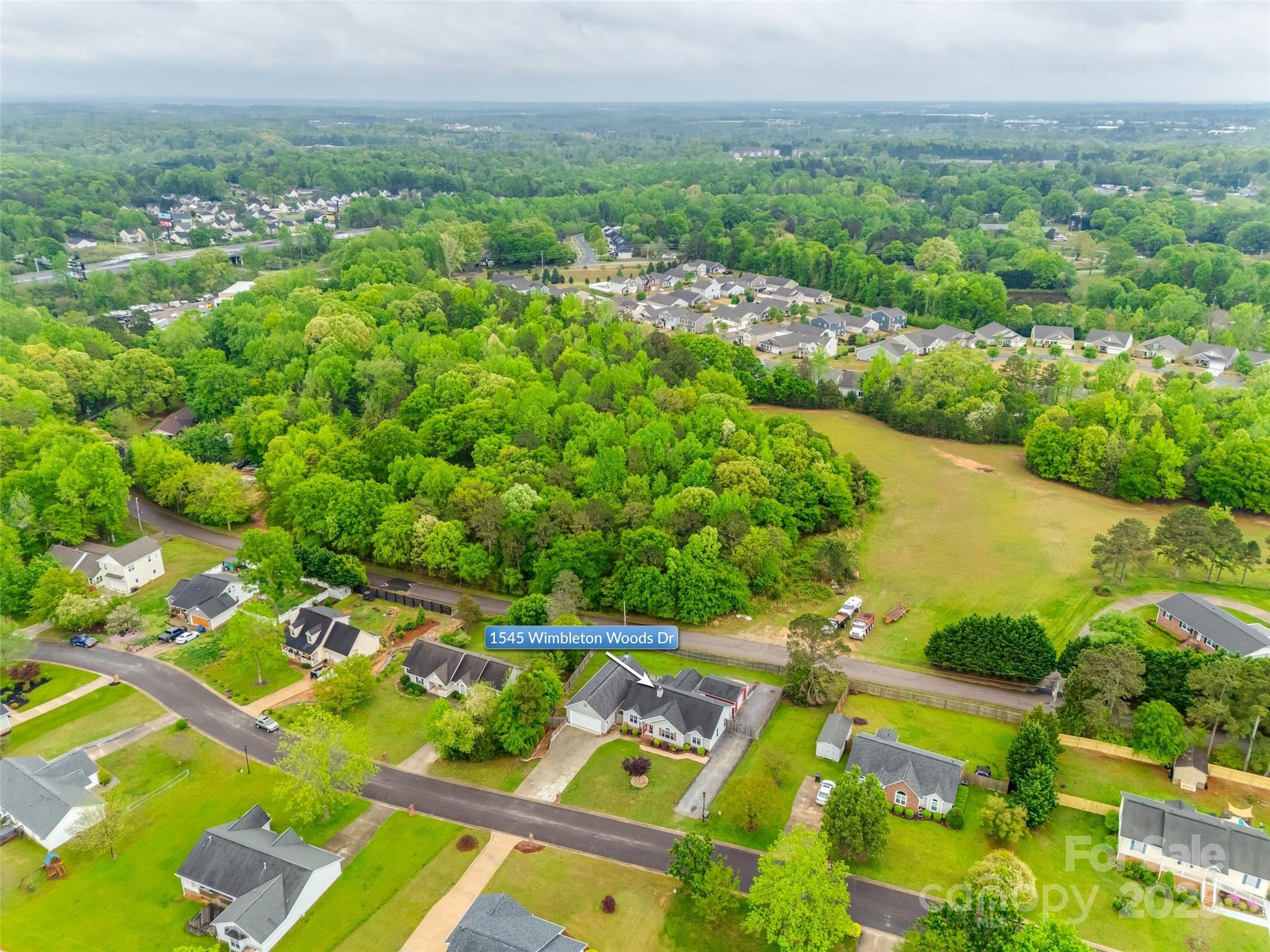 1545 Wimbleton Woods Drive Fort Mill, SC 29708 - Photo 40 of 42 an aerial view of residential houses with outdoor space and trees