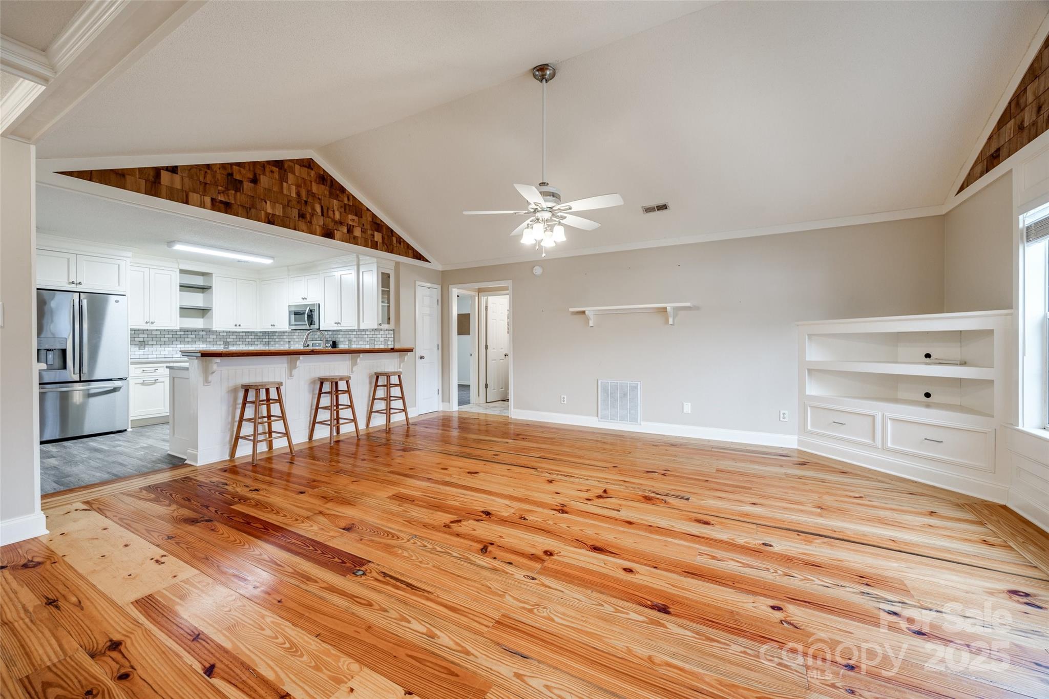 1545 Wimbleton Woods Drive Fort Mill, SC 29708 - Photo 5 of 42 a bedroom with a bed and a chandelier