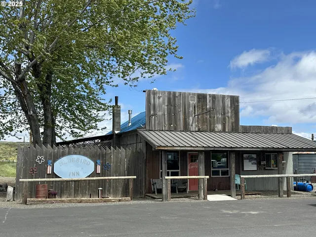 a view of a cafe with sitting area