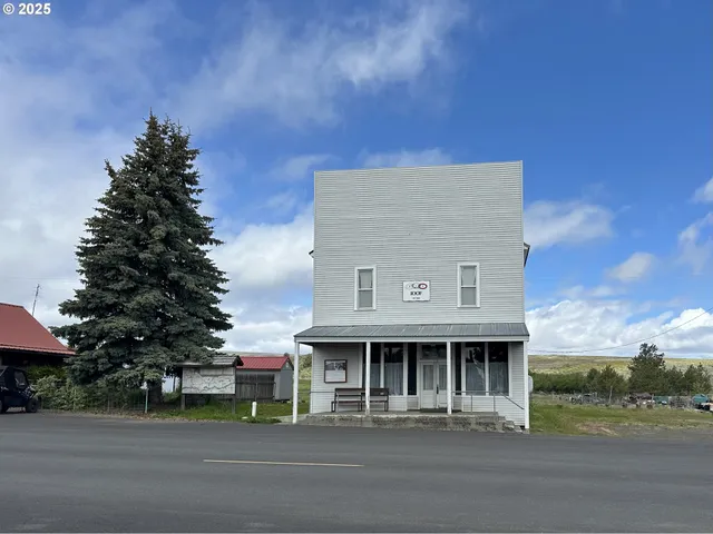 a patio with a table and chairs