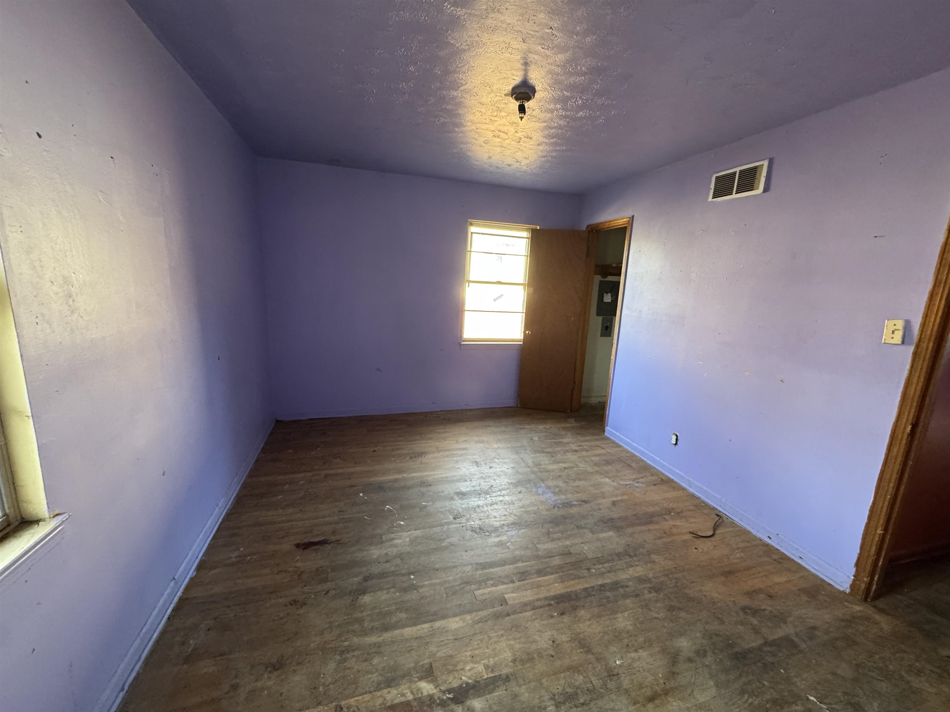 1640 Buxton Road Memphis, TN 38116 - Photo 8 of 16 Spare room with dark wood-type flooring and a textured ceiling