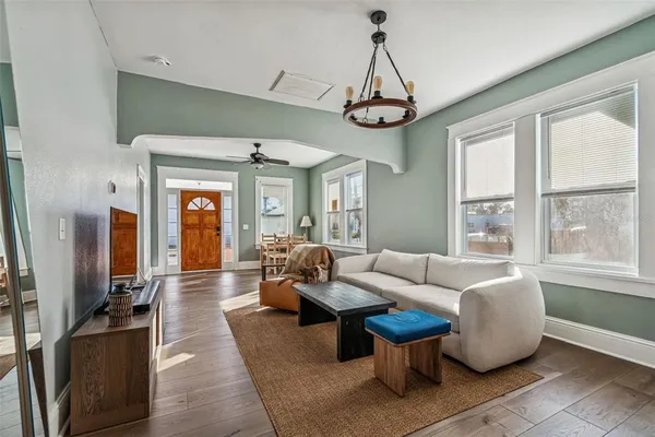 a dining room with furniture and window