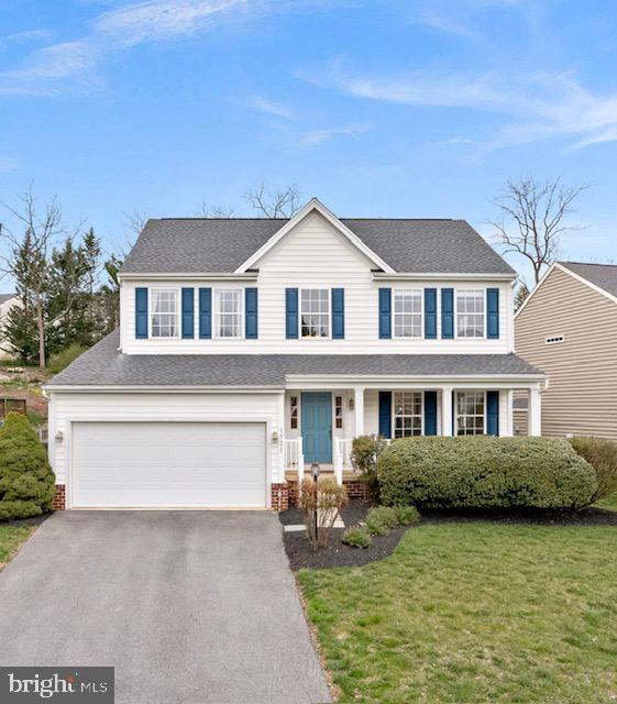 1921 Harvest Drive Winchester, VA 22601 - Photo 1 of 44 a front view of a house with garden