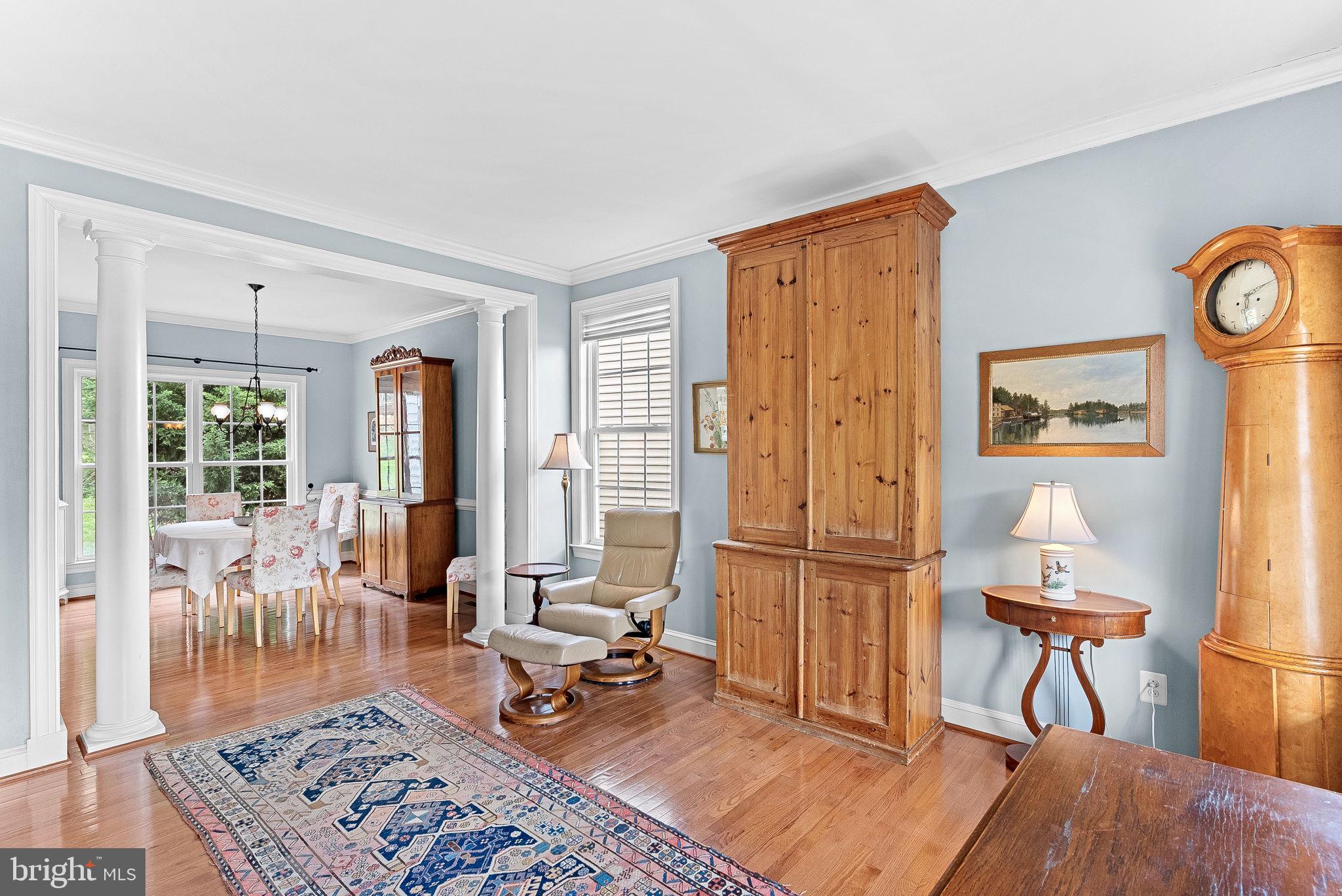 1921 Harvest Drive Winchester, VA 22601 - Photo 11 of 44 a living room with furniture a rug a flat screen tv and a table