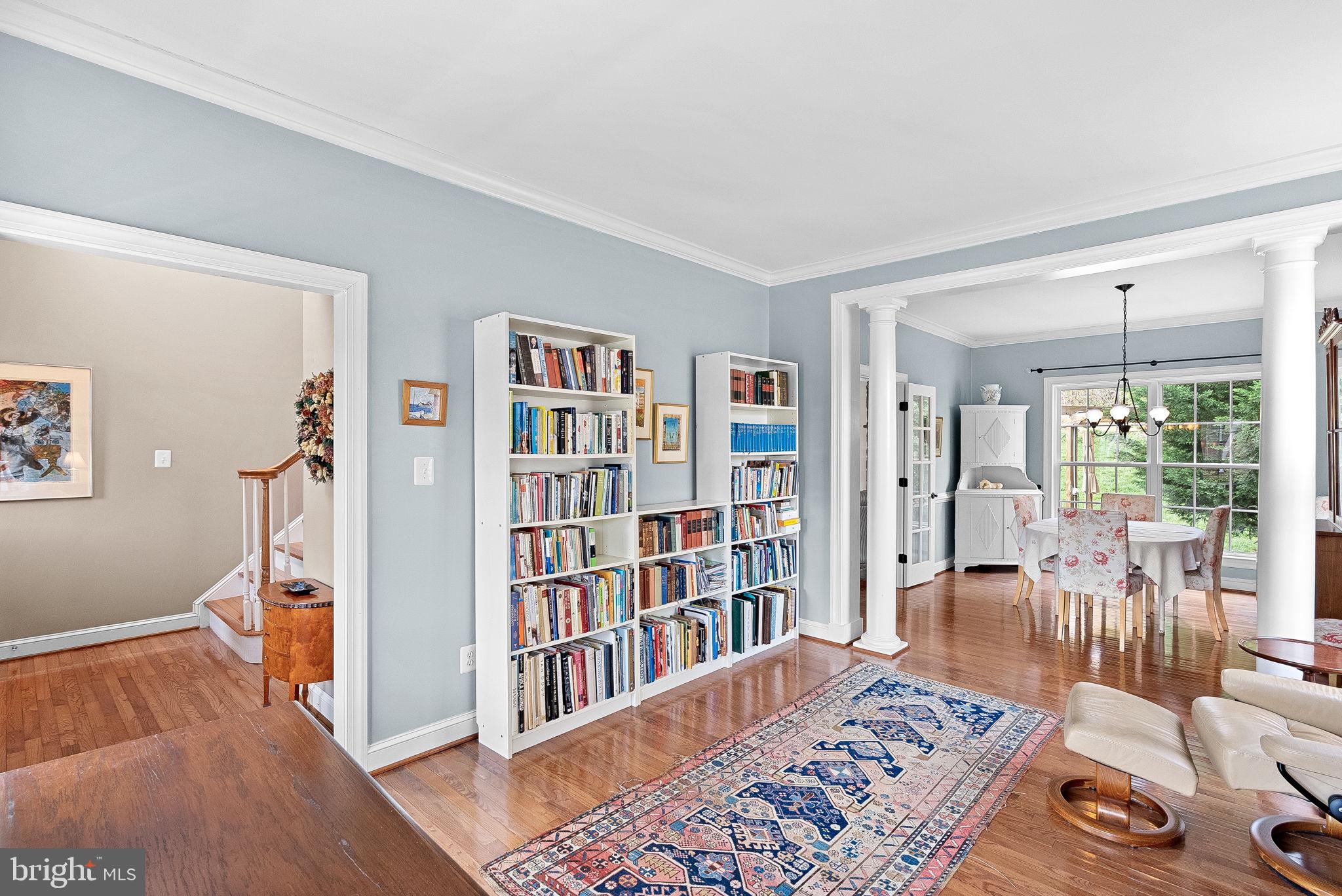 1921 Harvest Drive Winchester, VA 22601 - Photo 12 of 44 a room with furniture book shelf and wooden floor