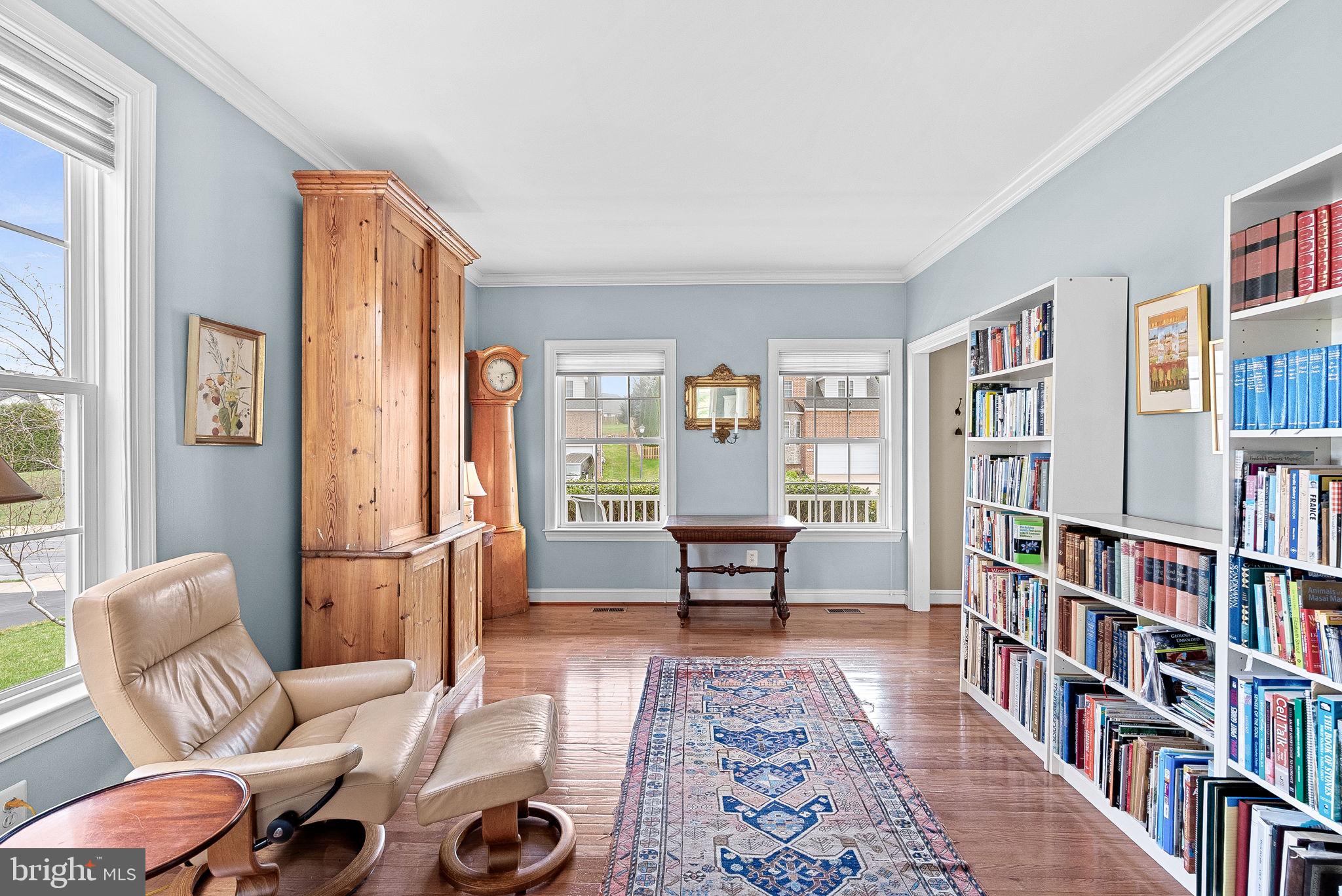 1921 Harvest Drive Winchester, VA 22601 - Photo 13 of 44 a living room with furniture and a book shelf