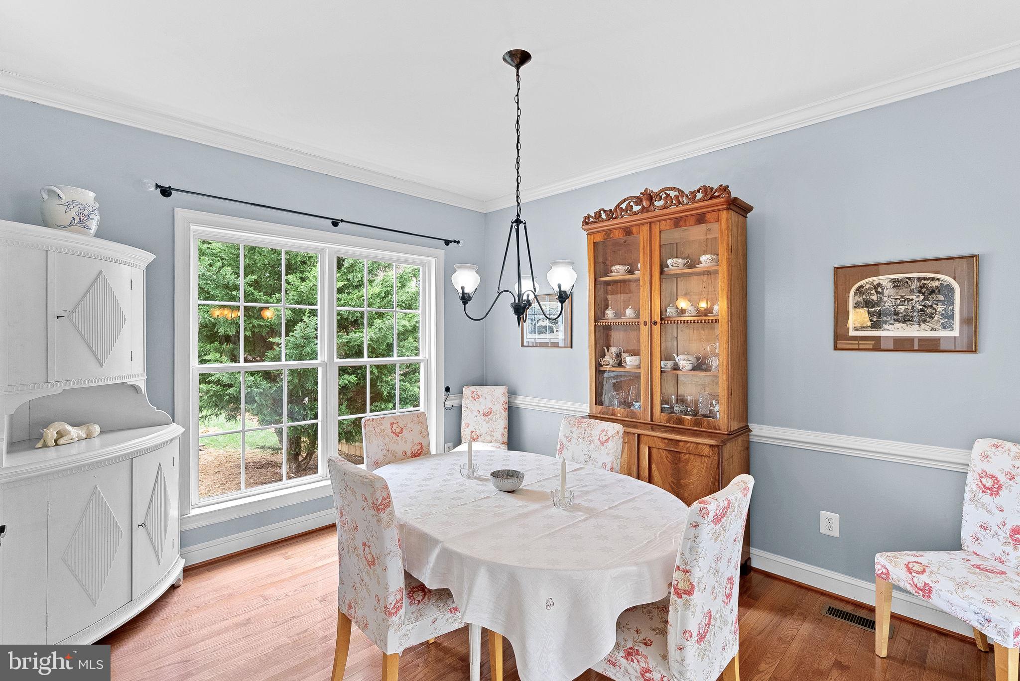 1921 Harvest Drive Winchester, VA 22601 - Photo 14 of 44 a view of a dining room with furniture window and wooden floor