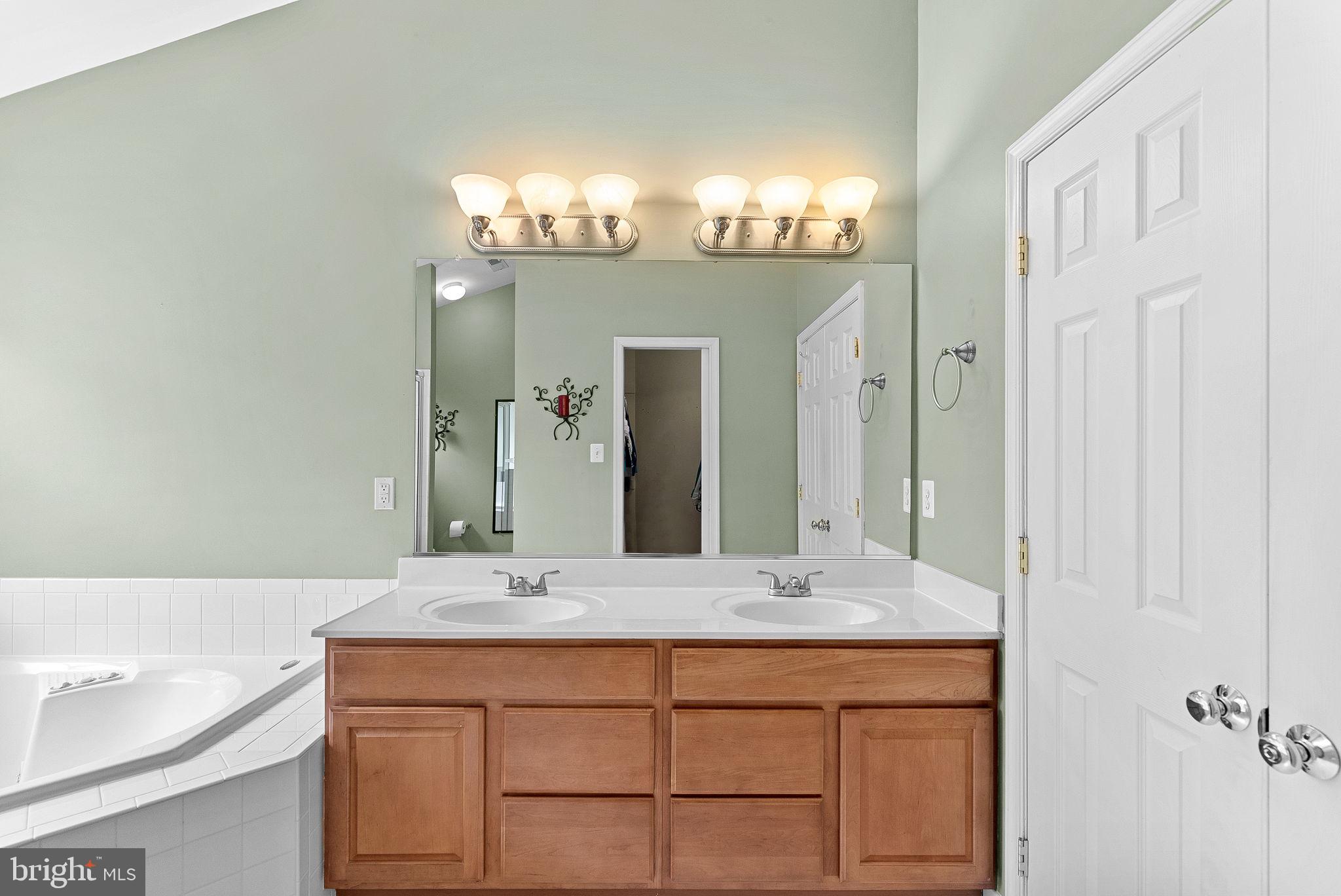1921 Harvest Drive Winchester, VA 22601 - Photo 27 of 44 a bathroom with a sink double vanity and a mirror