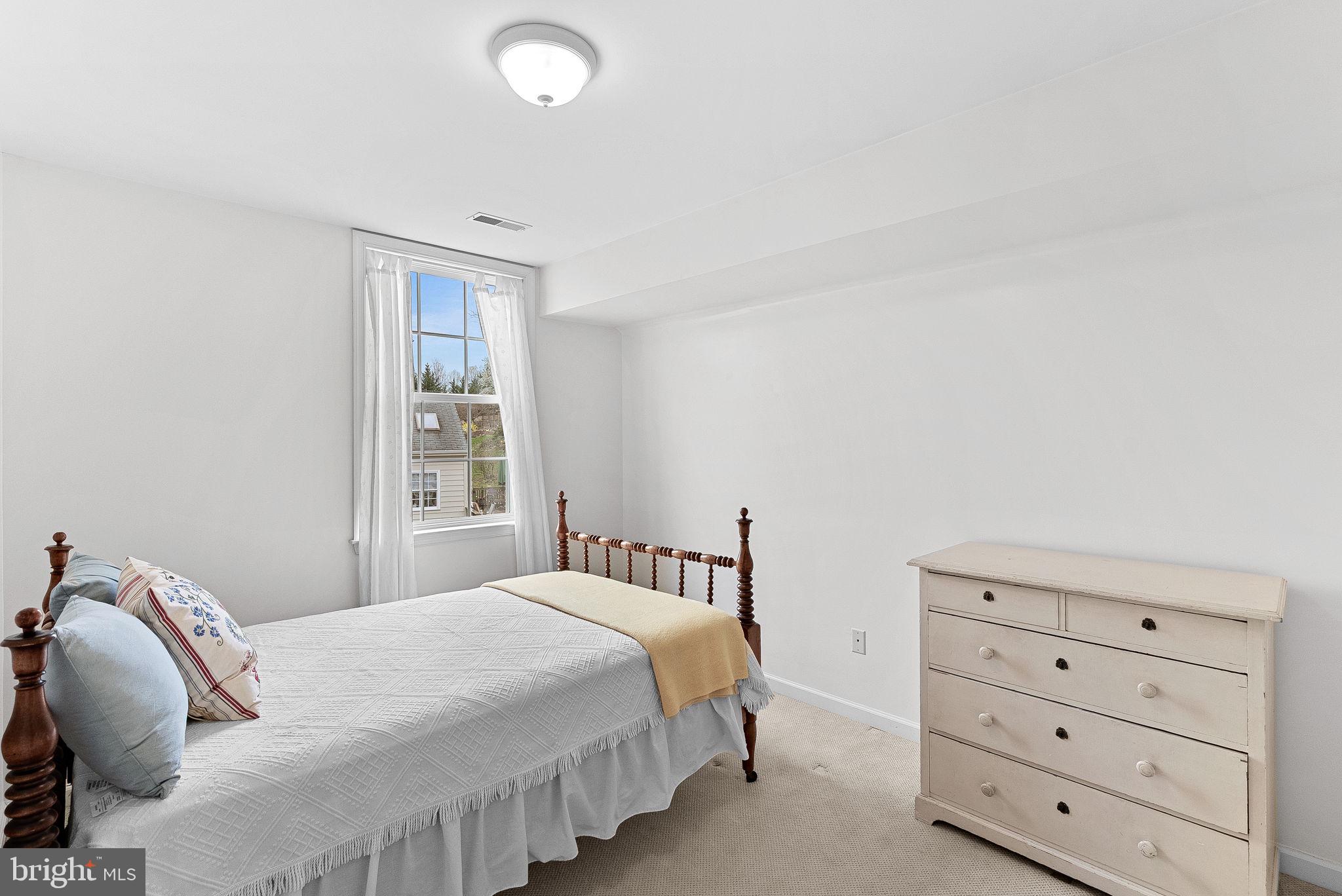 1921 Harvest Drive Winchester, VA 22601 - Photo 32 of 44 a bedroom with a bed and a window