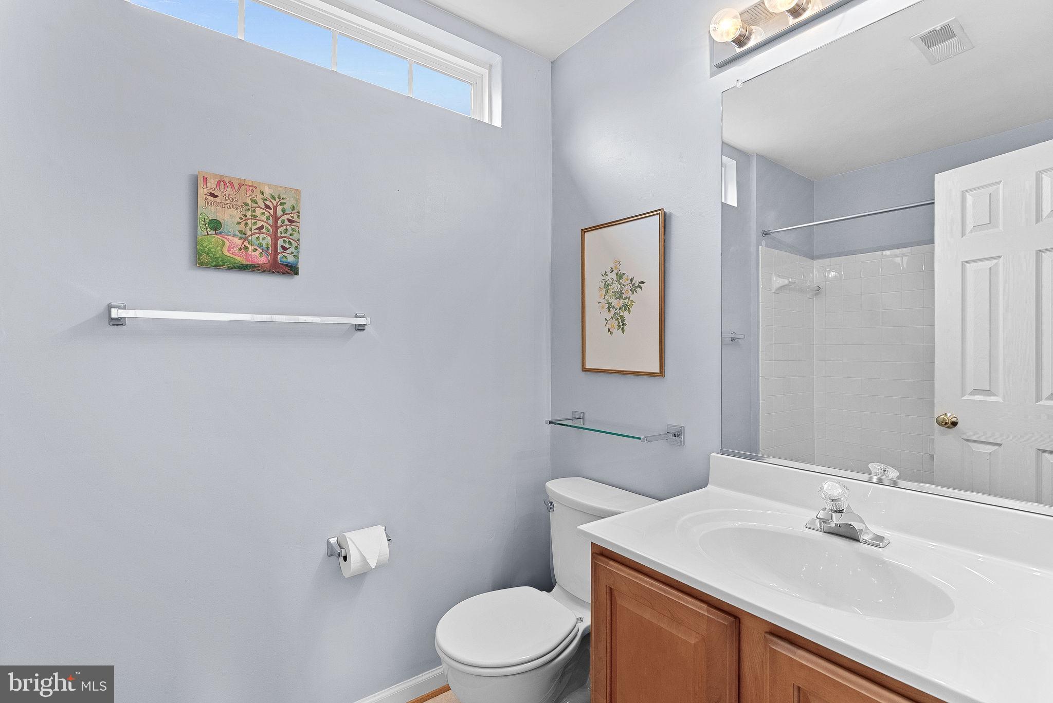 1921 Harvest Drive Winchester, VA 22601 - Photo 33 of 44 a bathroom with a sink mirror and toilet