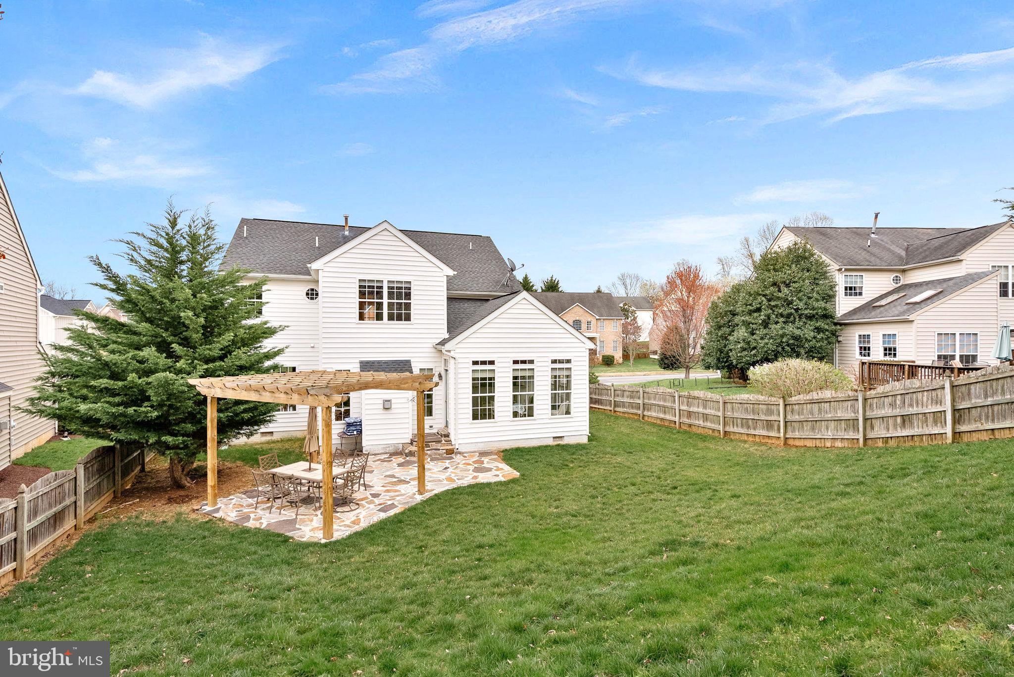1921 Harvest Drive Winchester, VA 22601 - Photo 38 of 44 a front view of a house with a yard table and chairs