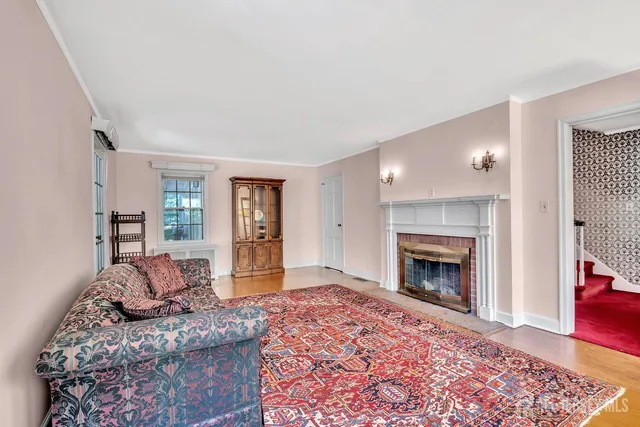 a living room with furniture and a rug