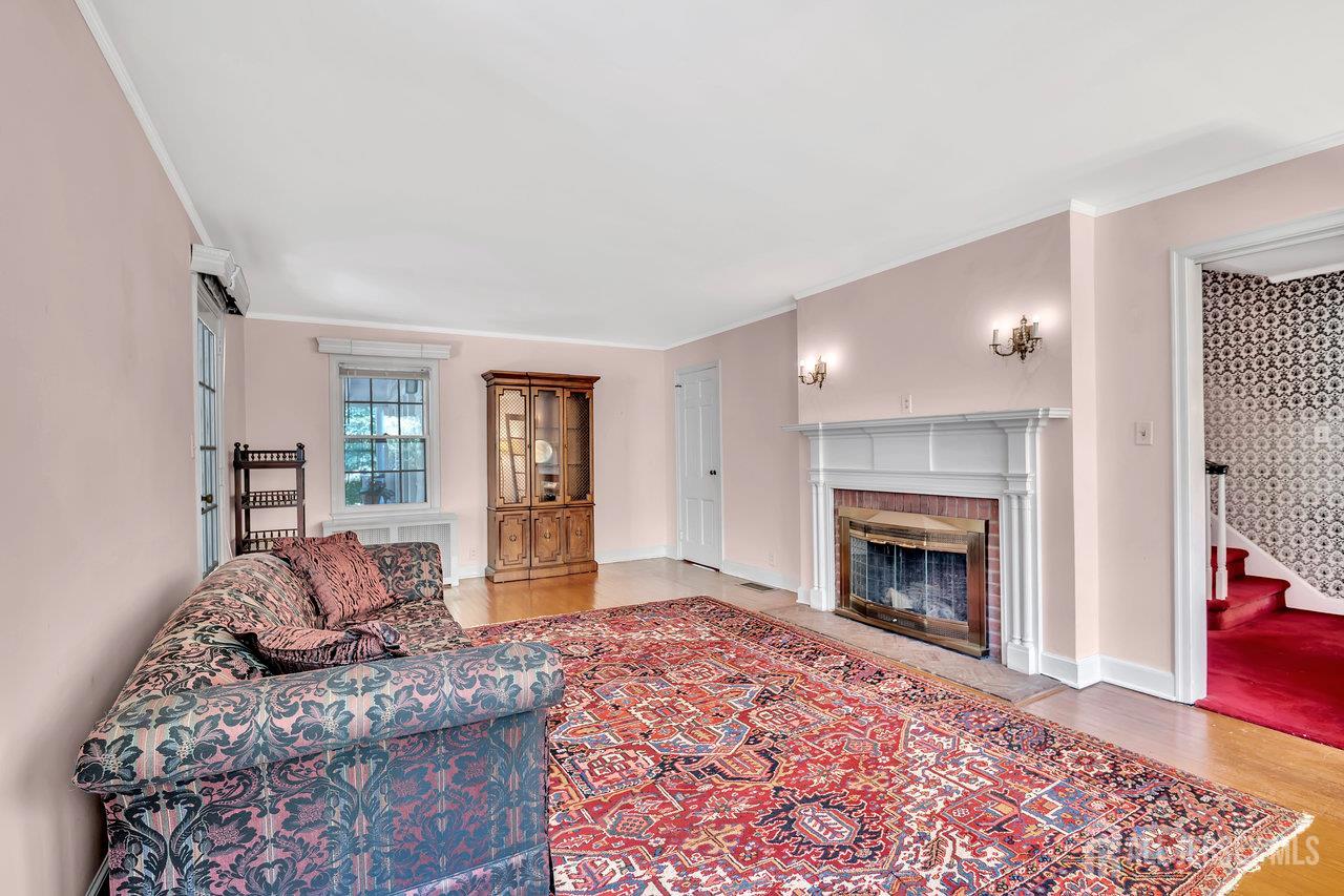 1010 River Road Piscataway, NJ 08854 - Photo 12 of 47 a living room with furniture and a fireplace