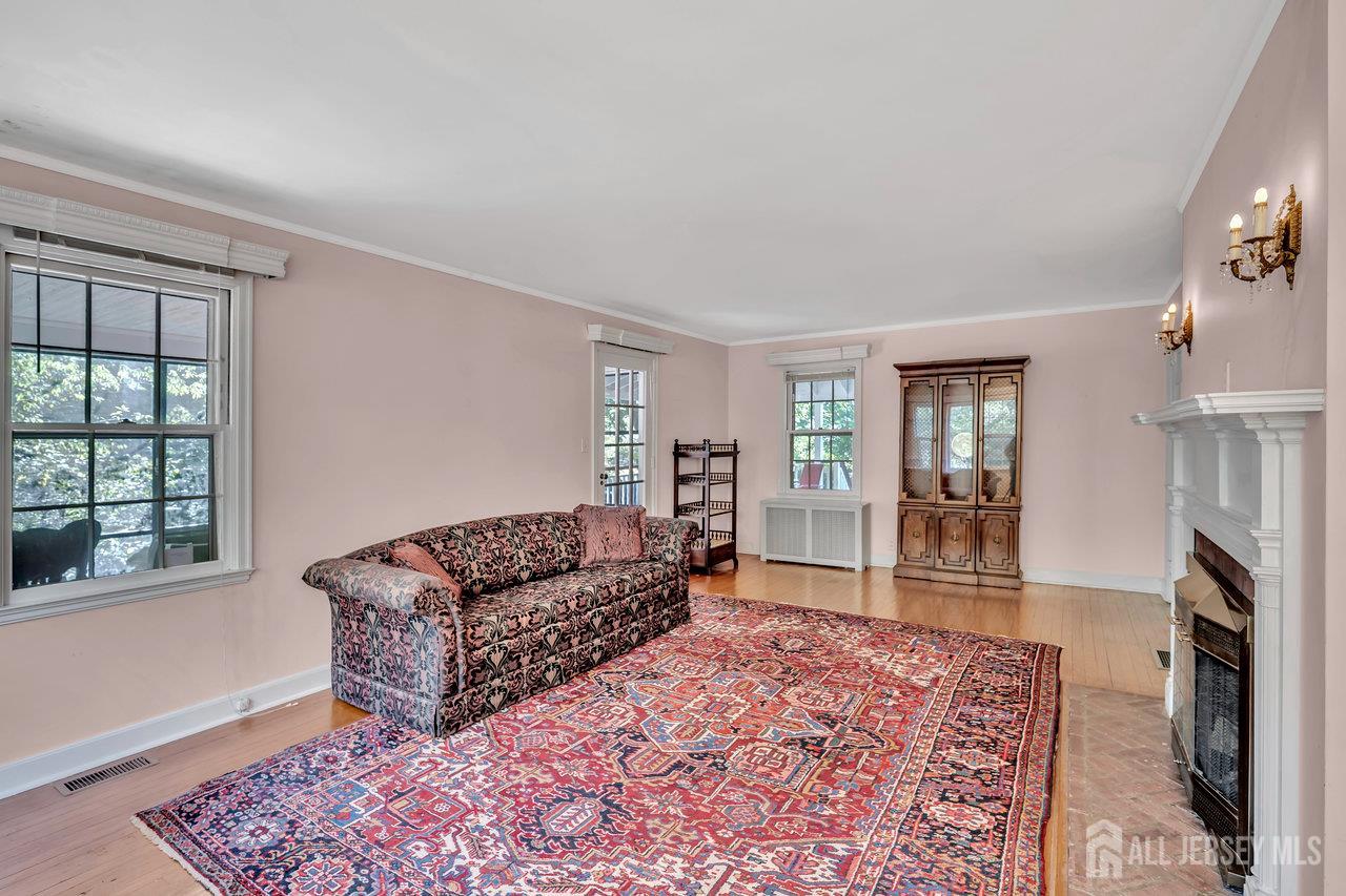 1010 River Road Piscataway, NJ 08854 - Photo 13 of 47 a living room with furniture and a rug