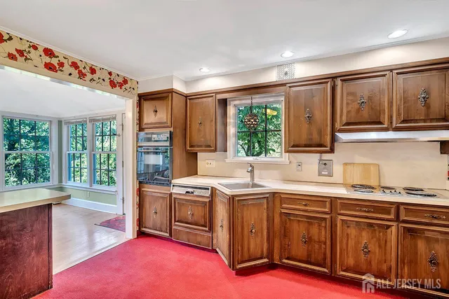 a kitchen with a stove and a sink