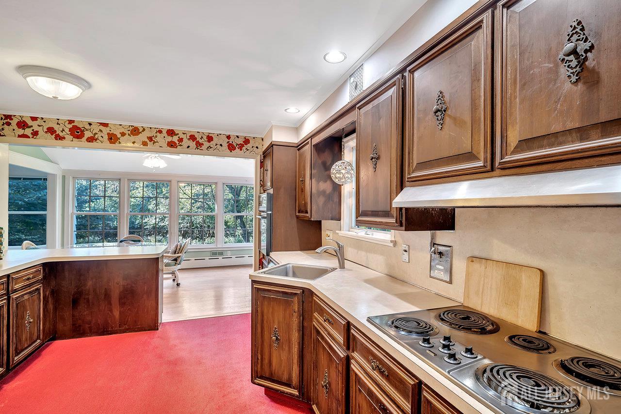 1010 River Road Piscataway, NJ 08854 - Photo 18 of 47 a kitchen with a stove and a sink