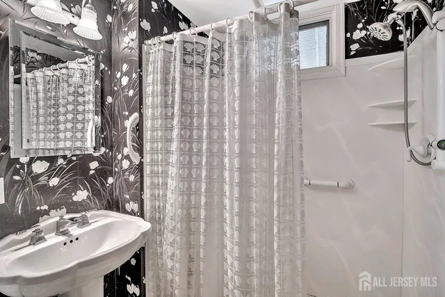 a dining hall with stainless steel appliances kitchen island granite countertop furniture and a kitchen view