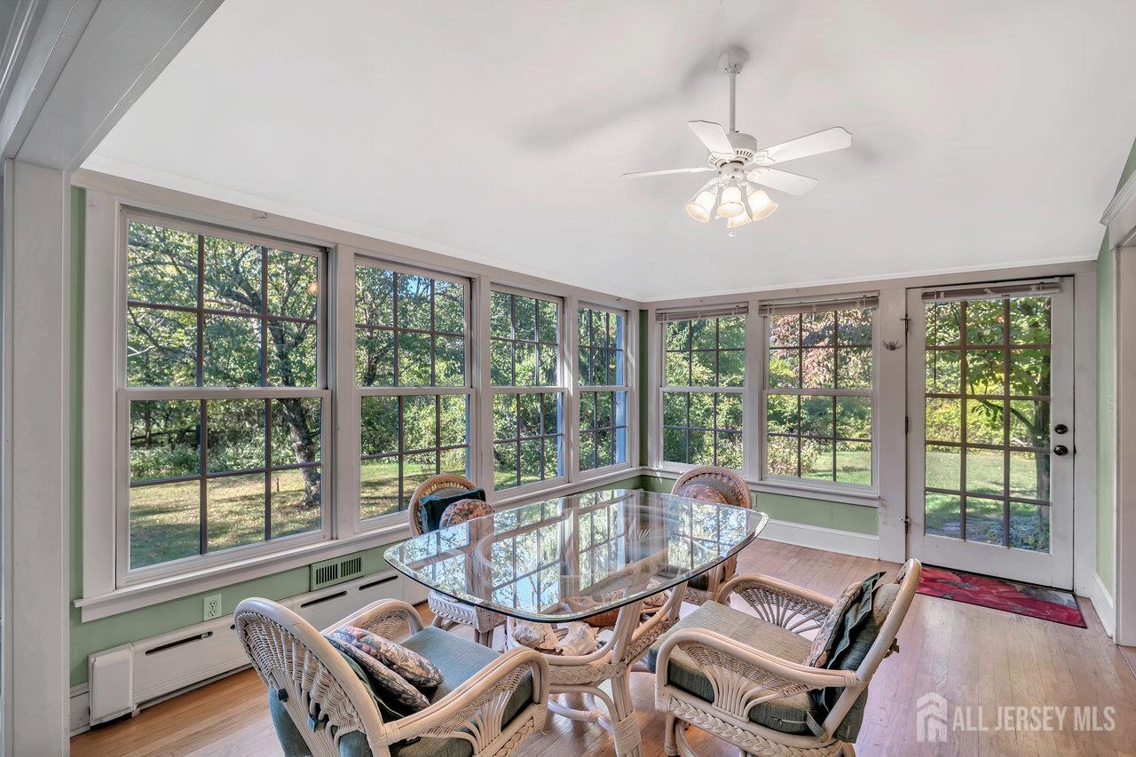 1010 River Road Piscataway, NJ 08854 - Photo 26 of 47 a living room with furniture and a floor to ceiling window