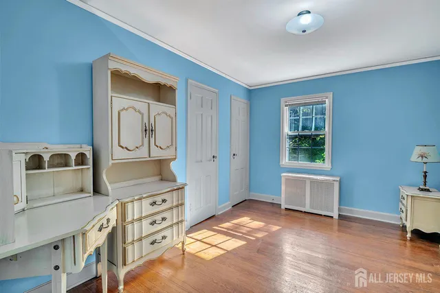 a bedroom with a bed and dresser