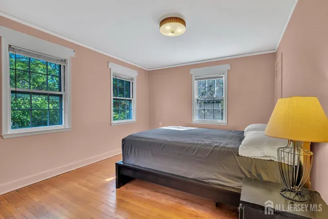 a bedroom with a bed and a lamp