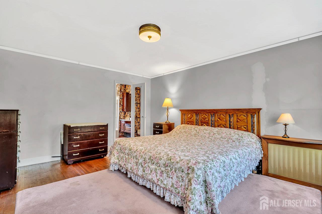 1010 River Road Piscataway, NJ 08854 - Photo 32 of 47 a bedroom with a bed and dresser