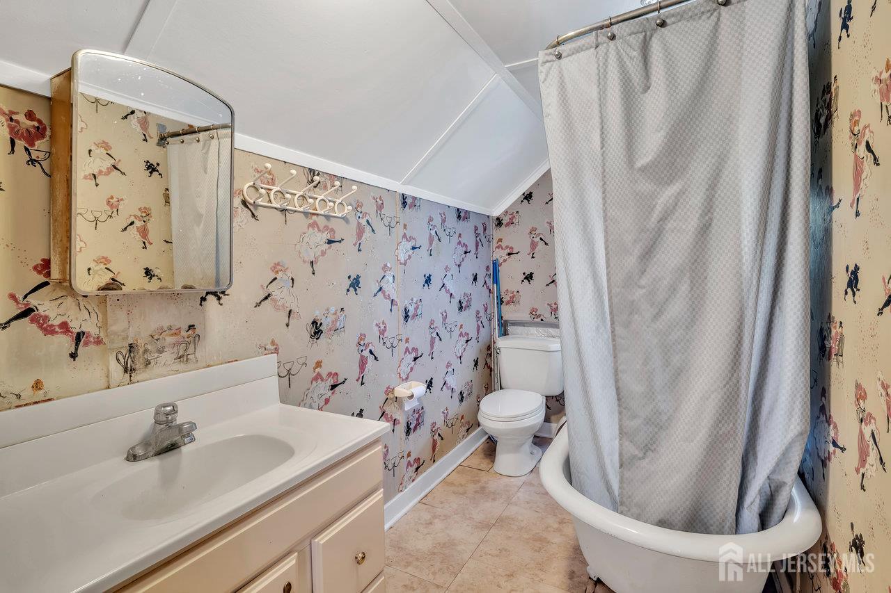1010 River Road Piscataway, NJ 08854 - Photo 38 of 47 a bath room with a sink and a toilet