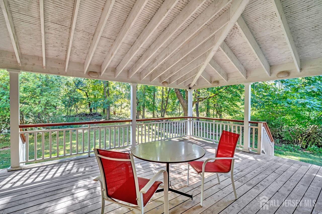 1010 River Road Piscataway, NJ 08854 - Photo 42 of 47 an outdoor sitting area with furniture and wooden floor