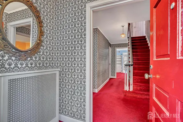 a view of an entryway with wooden floor