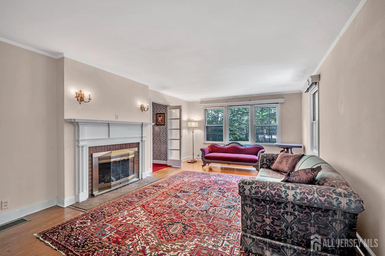 1010 River Road Piscataway, NJ 08854 - Photo 10 of 47 a living room with furniture and a fireplace