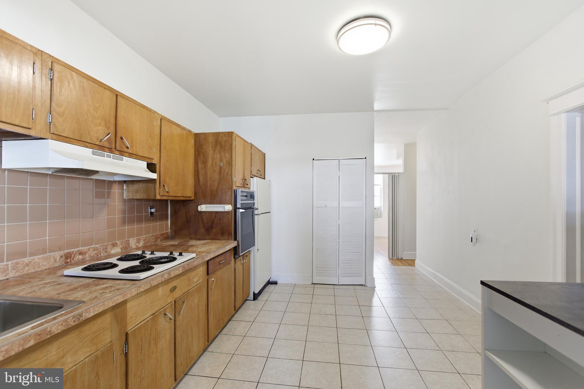 6 Barney Circle Southeast, Unit 1 Washington, DC 20003 - Photo 6 of 14 a kitchen with sink cabinets and stainless steel appliances