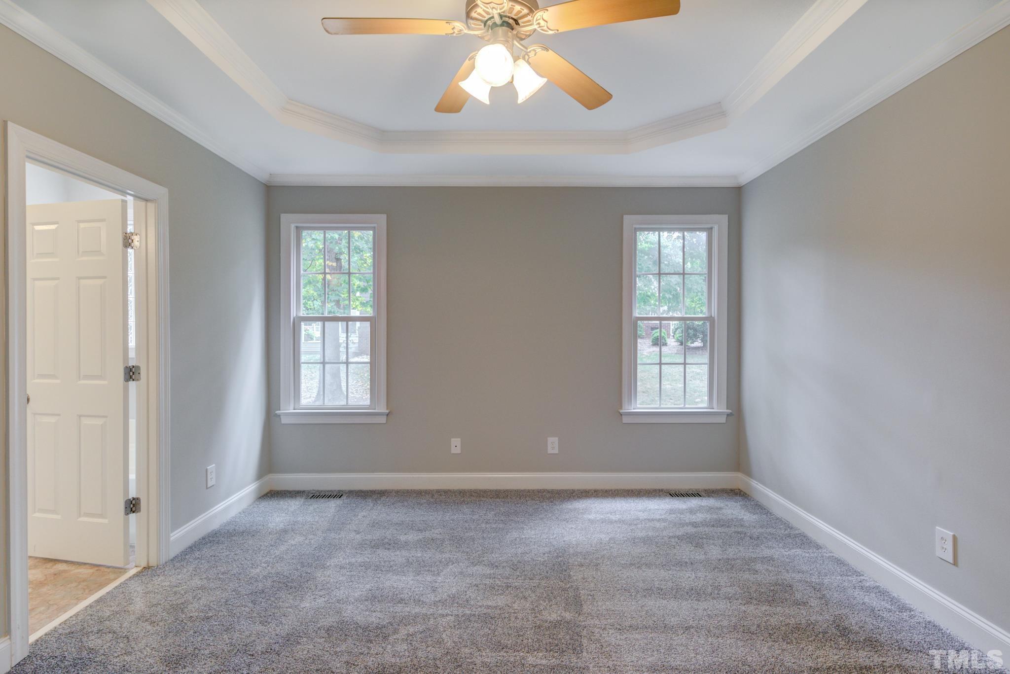 4425 Irene Way Raleigh, NC 27603 - Photo 22 of 28 a view of an empty room with wooden floor and a window
