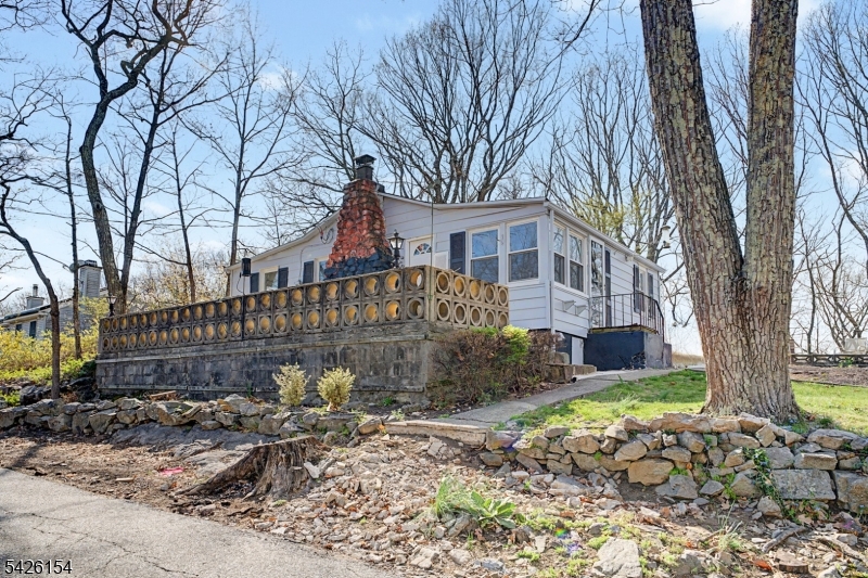 10 Berton Road Boonton, NJ 07005 - Photo 18 of 20 a front view of a house with garden