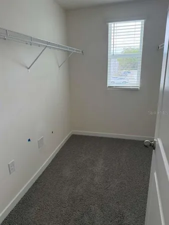 a view of a room that has a window in it
