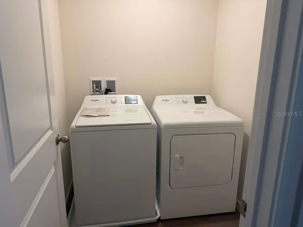 a utility room with dryer and washer